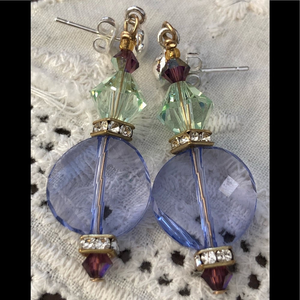 Swarovski crystal earrings in purple and green.